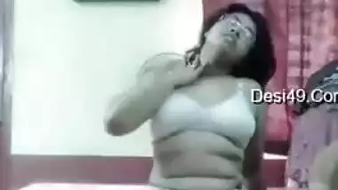 Desi camgirl with glasses undresses performing a dance in XXX show