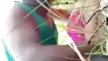 Young couple lovers enjoying sexy outdoor fun in the rice field